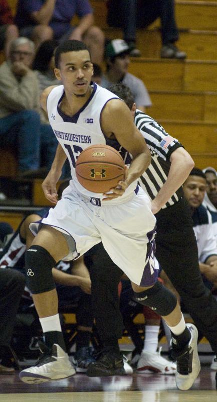 Graduate student Jared Swopshire dribbles up the court. Swopshire and the Cats struggled after injuries to seniors Reggie Hearn and Drew Crawford.