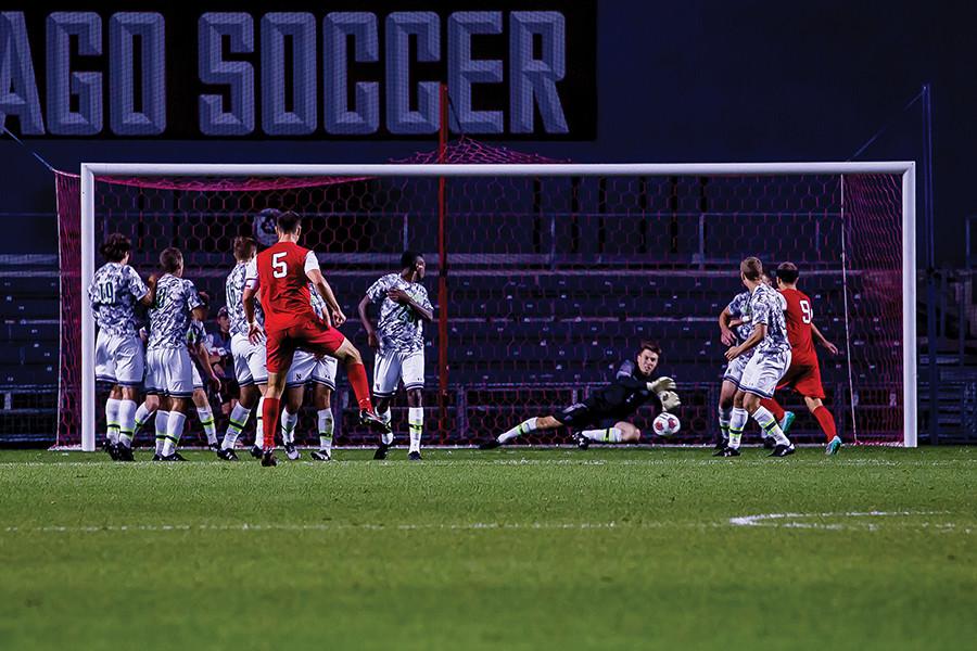 Senior goalkeeper Zak Allen dives to save a free kick. Allen made a number of key saves but was unable to lift the Wildcats to victory, ending his career with a 2-0 loss to Rutgers in the Big Ten Tournament.