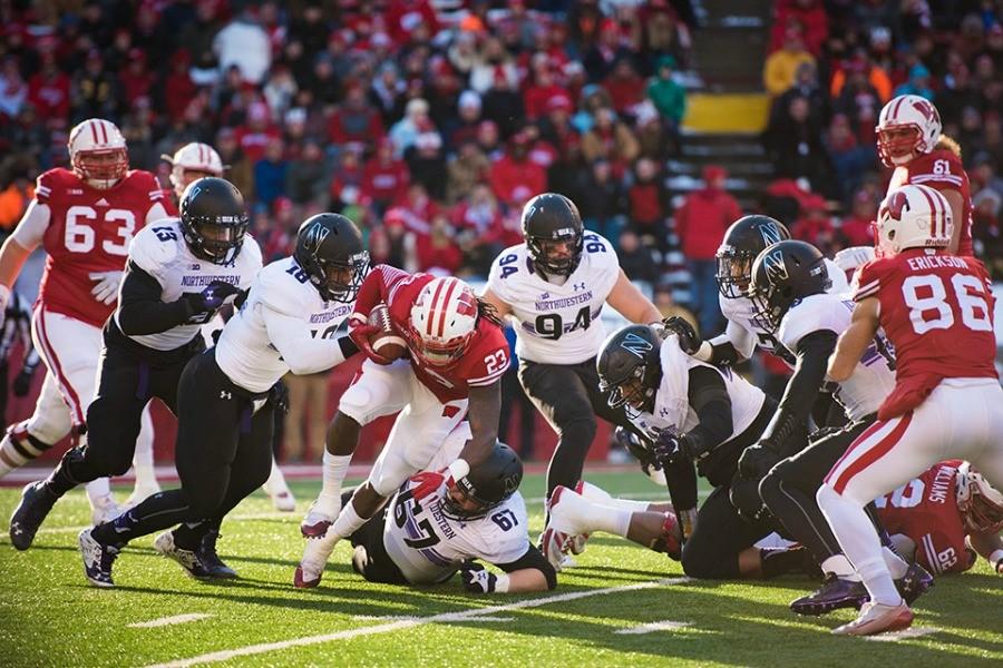 Anthony Walker (18) makes a tackle against Wisconsin. Walker was recently named first-team all-Big Ten, and some of his teammates say he deserves an All-American nod.