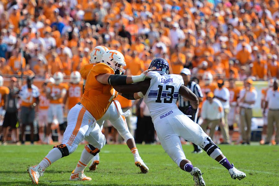 Senior defensive end Deonte Gibson battles against a Tennessee player. The Wildcat captain along with his senior teammates played their last game for Northwestern on Friday.