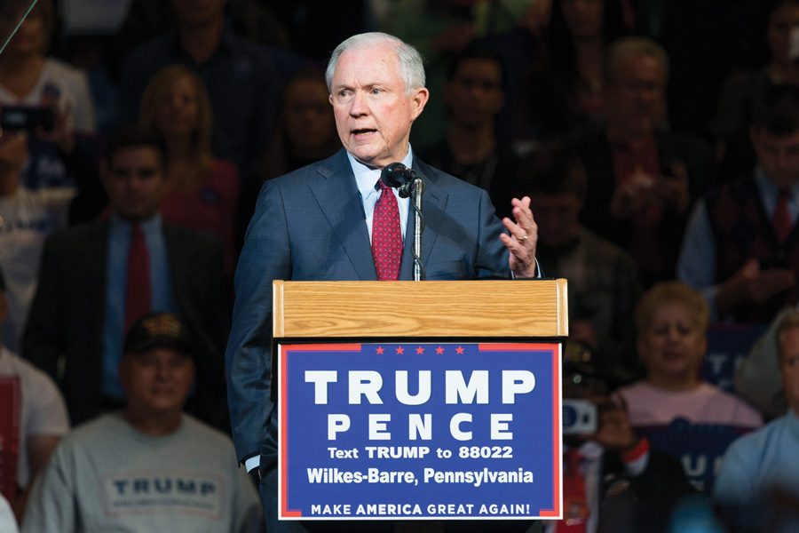 U.S. Senator Jeff Sessions campaigns for Donald Trump in October. Sessions has been offered the position of attorney general.