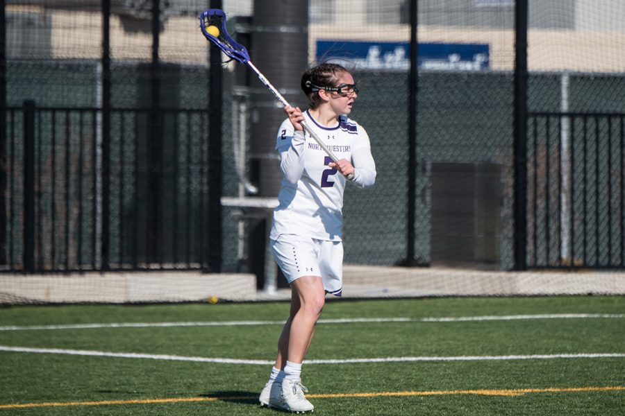 Selena Lasota looks for a pass recipient. The junior attacker scored 5 goals in Saturday’s quarterfinal against North Carolina, but Northwestern still lost, 19-14.