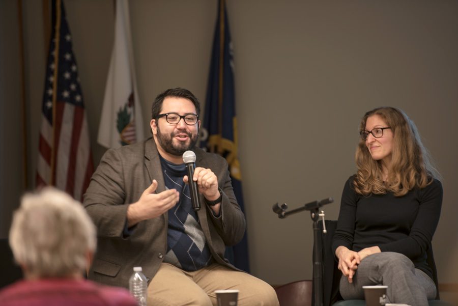 Journalist Alex V. Hernandez talks during the panel held at Evanston Public Library on Monday night. Hernandez and Prof. Wendy Pearlman discussed covering refugees, immigrants and asylum seekers through storytelling.