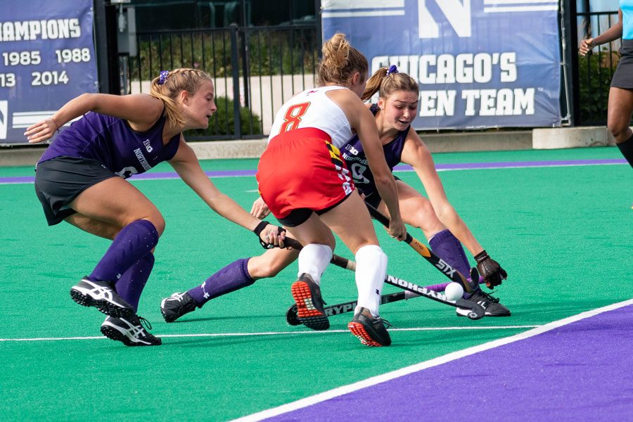 Midfielders Peyton Halsey and Shannon Daley reach for the ball. Both players started the game against Maine on Sunday.