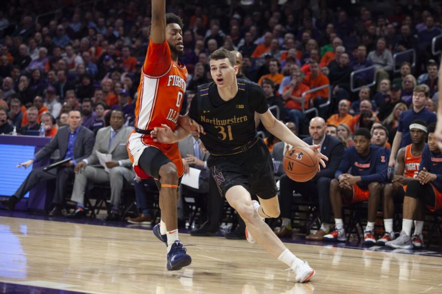 (Joshua Hoffman, The Daily Northwestern). Robbie Beran drives the lane. The freshman forward struggled to score against Illinois.