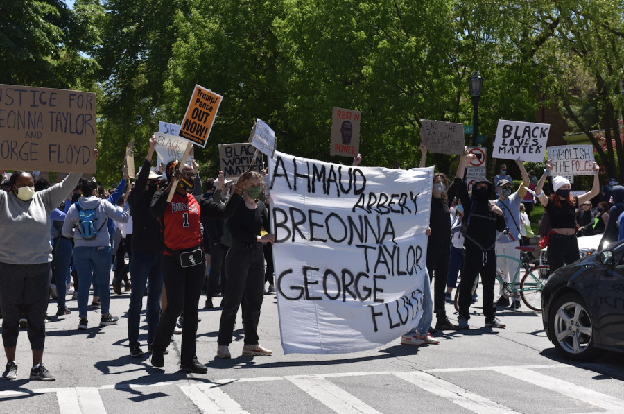 Evanston residents gathered Sunday afternoon to protest police brutality. Those photographed above were asked by the photographer for their permission before the photo was taken
