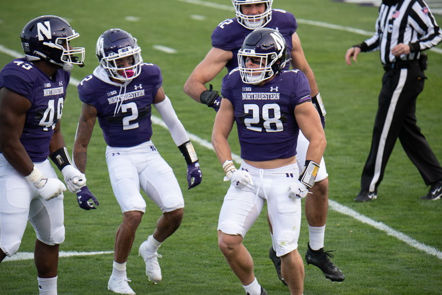 Chris Bergin (28) flexes after a tackle. Bergin, Paddy Fisher (42) and Greg Newsome (2) were All-Big Ten honorees. 