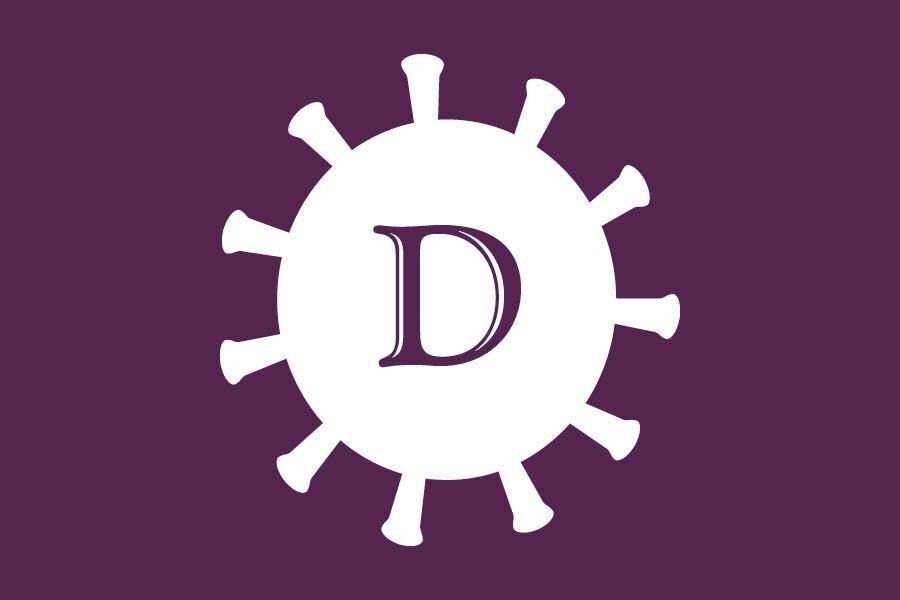 A white cartoon illustration of the SARS-CoV-2 virus against a purple background with The Daily Northwestern’s logo letter “D” in the center of the cartoon image.