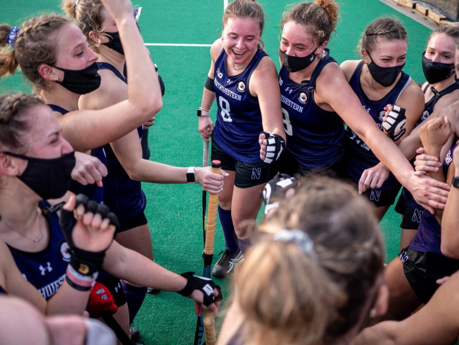 Northwestern field hockey huddles before a game.