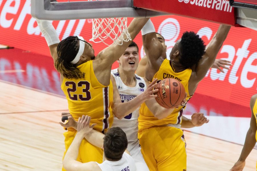 Men’s player attempts a layup.