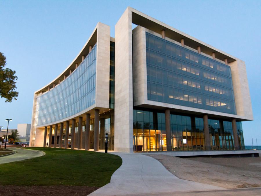 Picture of building with glass windows in the evening.