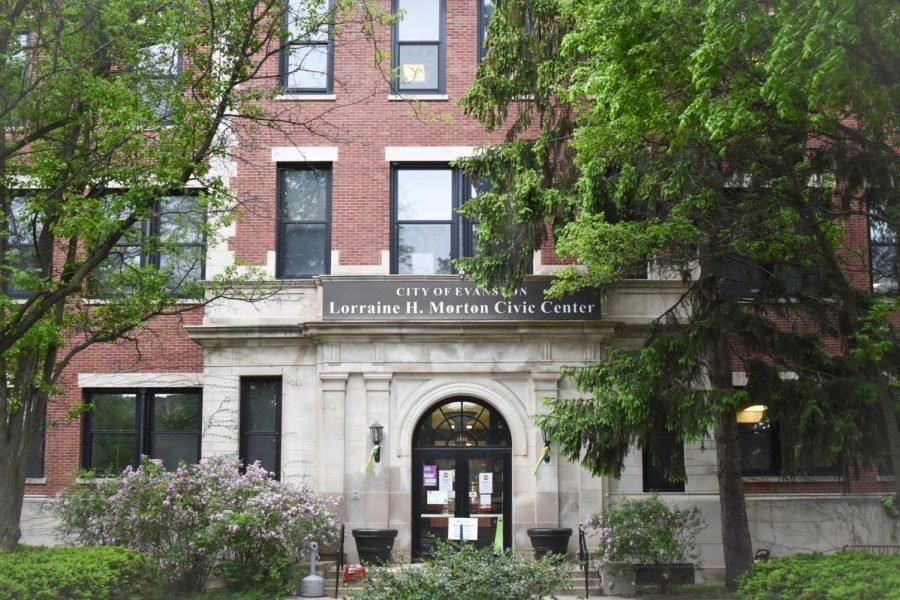 A brick building with trees surrounding it.