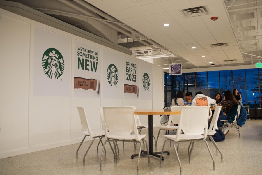 A construction box featuring Starbucks lettering “We’re brewing something new” and “Opening early 2023.”