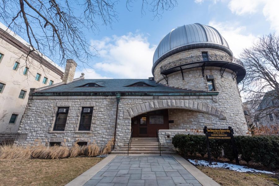 A stone building with an observatory against a blue sky.