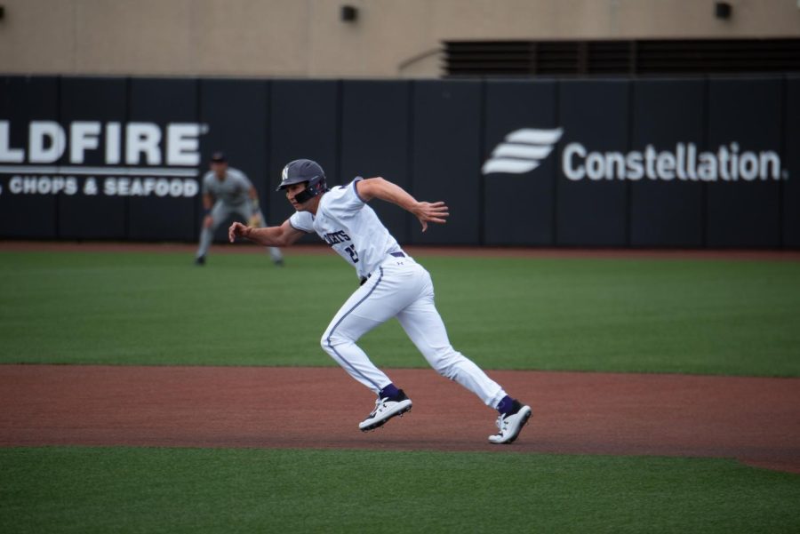 Man in white uniform runs