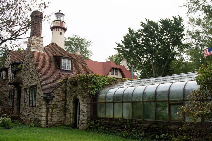 A moss-covered building with a red roof