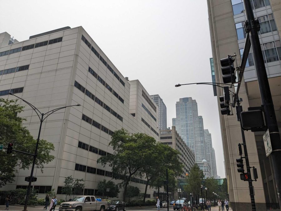 Gray, smoky skies are visible over buildings.