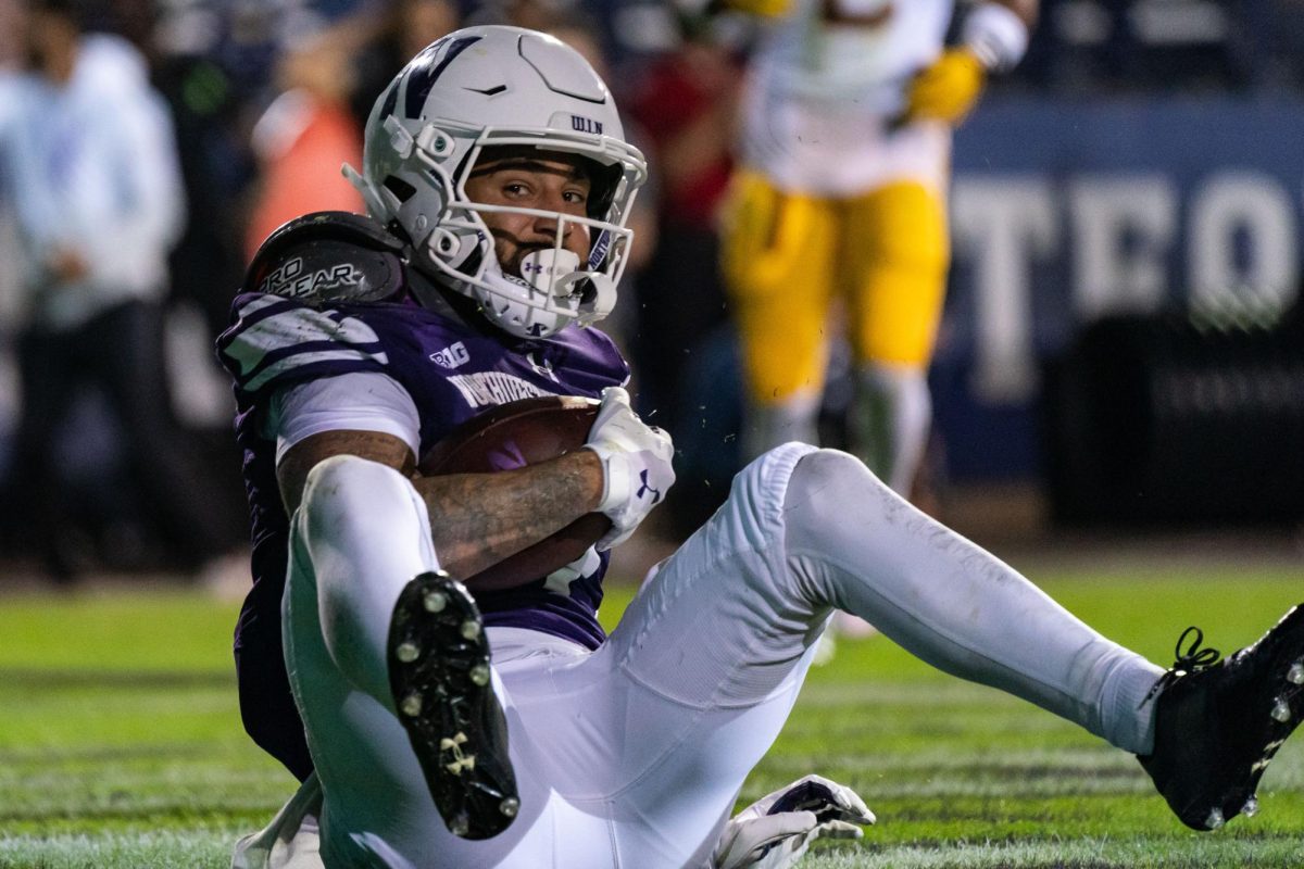 Graduate student wide receiver Bryce Kirtz hauls in a touchdown grab during last season's comeback against Minnesota. Kirtz opened the 2024 season with 91 receiving yards on Saturday.
