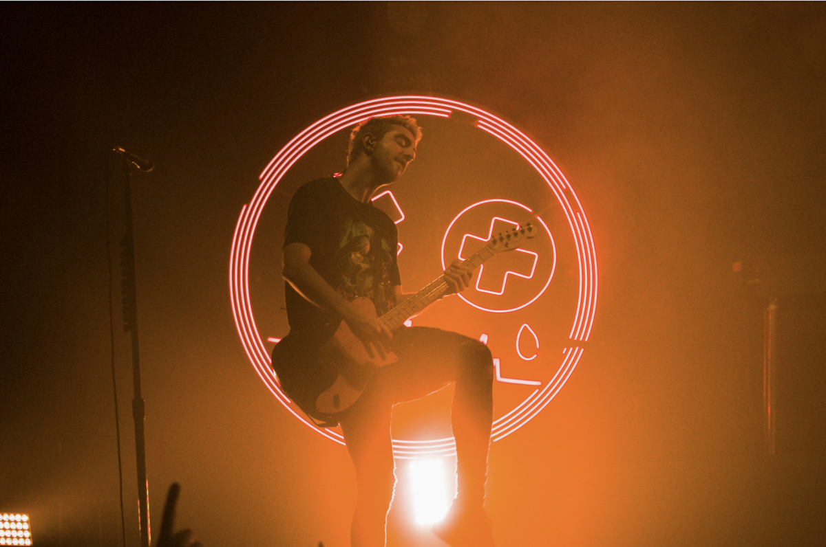 All Time Low lead guitarist Jack Backarat struts his stuff during the band’s headlining show at Aragon Ballroom on Sept. 23. 