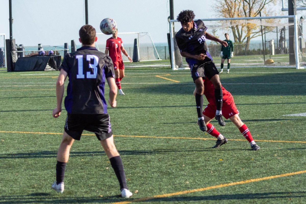 Sophomore midfielder Jason Gajadhar wins a header in last season’s matchup against Wisconsin. Gajadhar played 81 minutes against the Badgers on Tuesday. 