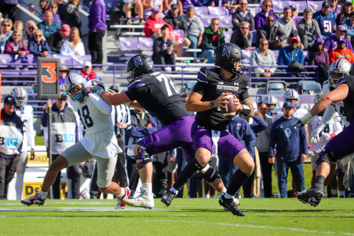 Northwestern quarterback Brendan Sullivan pans the field to make a pass. Sullivan threw for 131 yards in the win against Howard. 