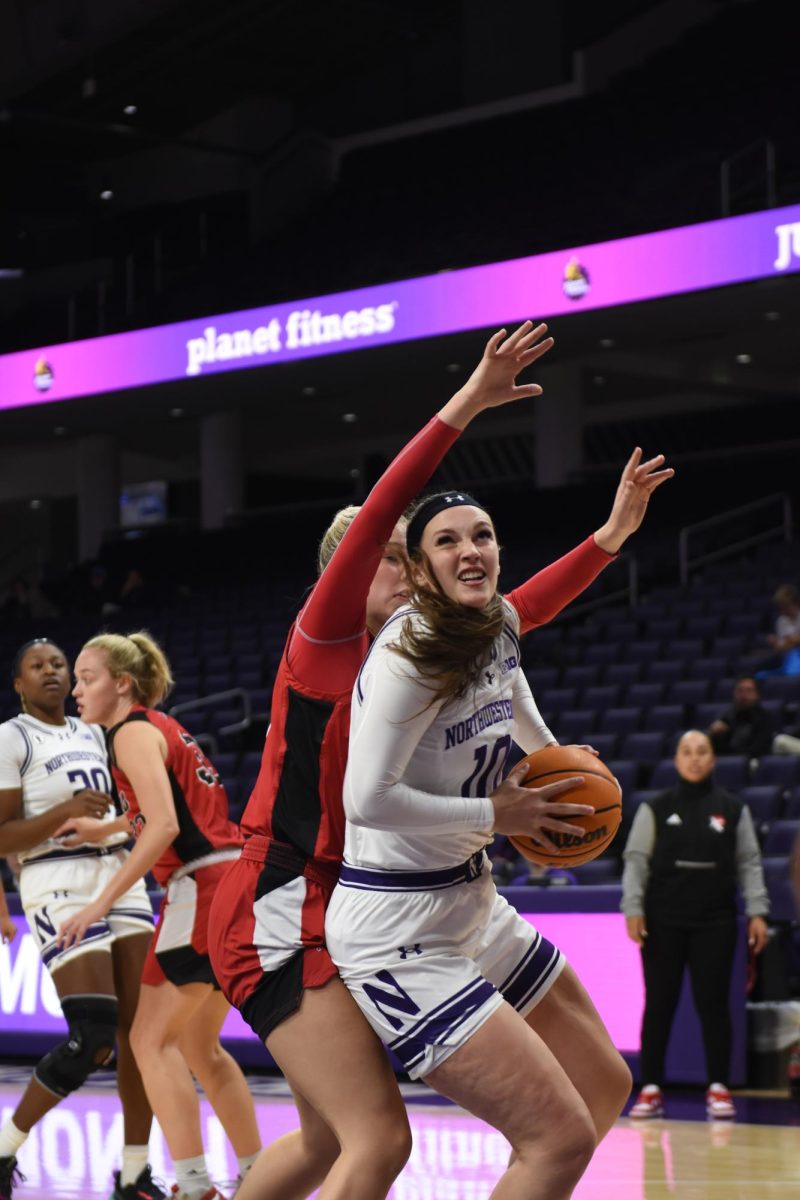 Junior forward Caileigh Walsh fights to get to the basket in a game earlier this season. Walsh scored a career-high 27 points in Northwestern’s win against Southeast Missouri State on Sunday.