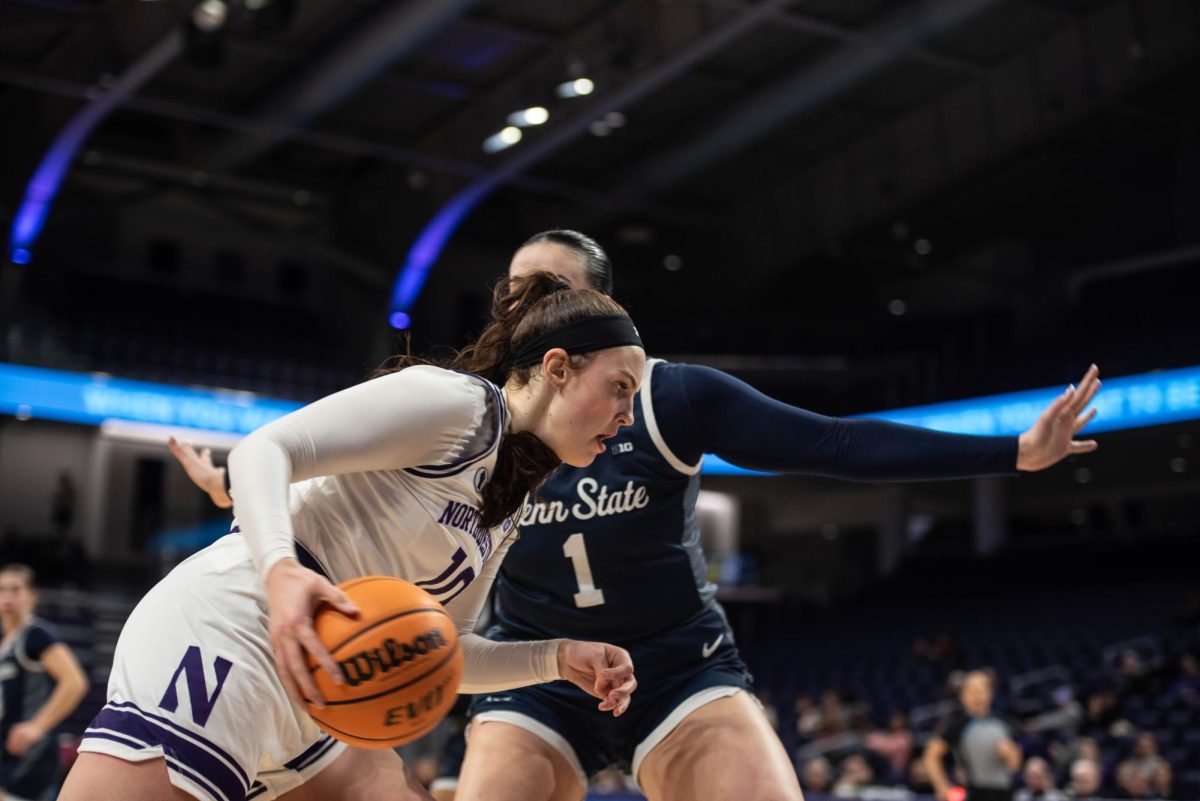 Junior forward Caileigh Walsh looks to back down an opponent Thursday.