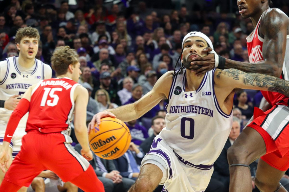 Graduate student guard Boo Buie drives the lane.