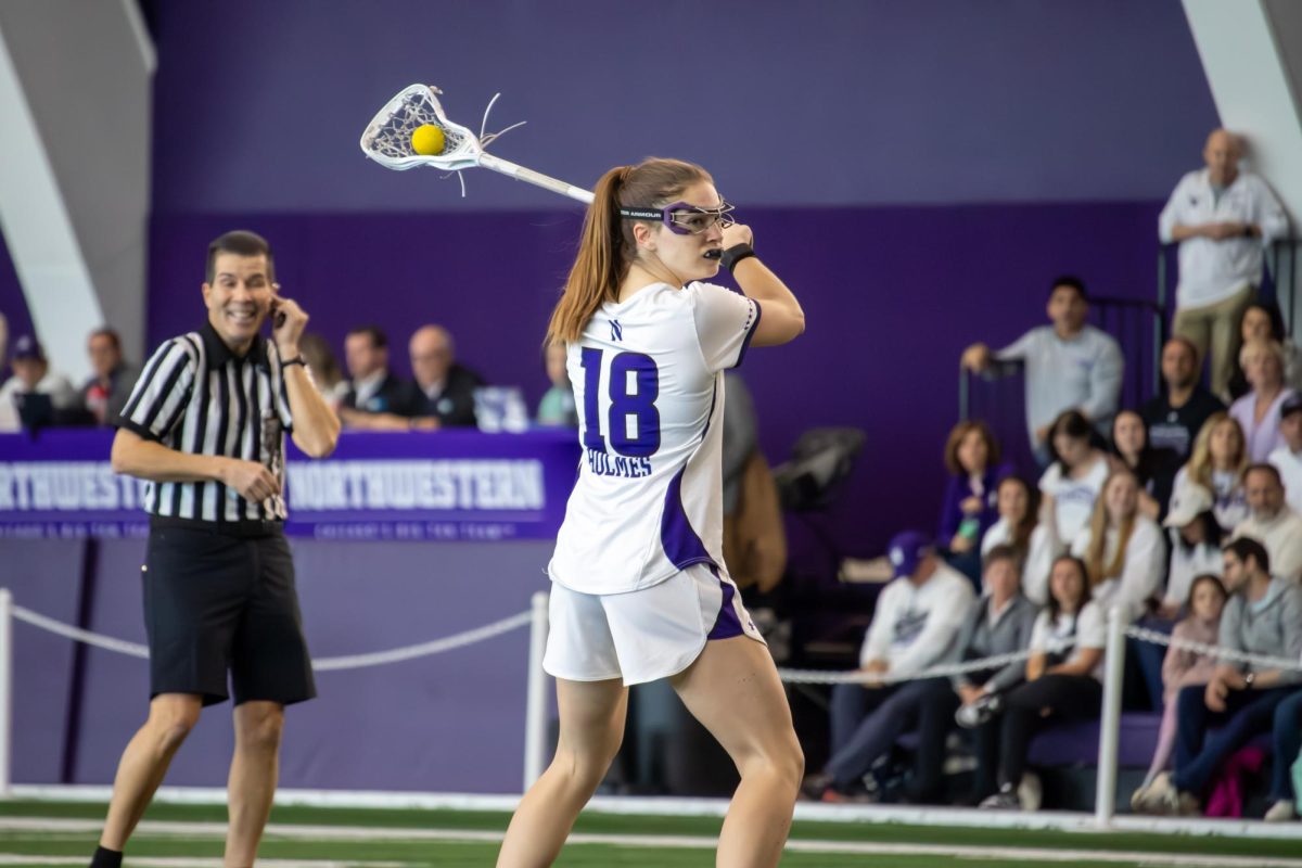 Senior attacker Leah Holmes readies to take a free-position shot during week's game against Syracuse.