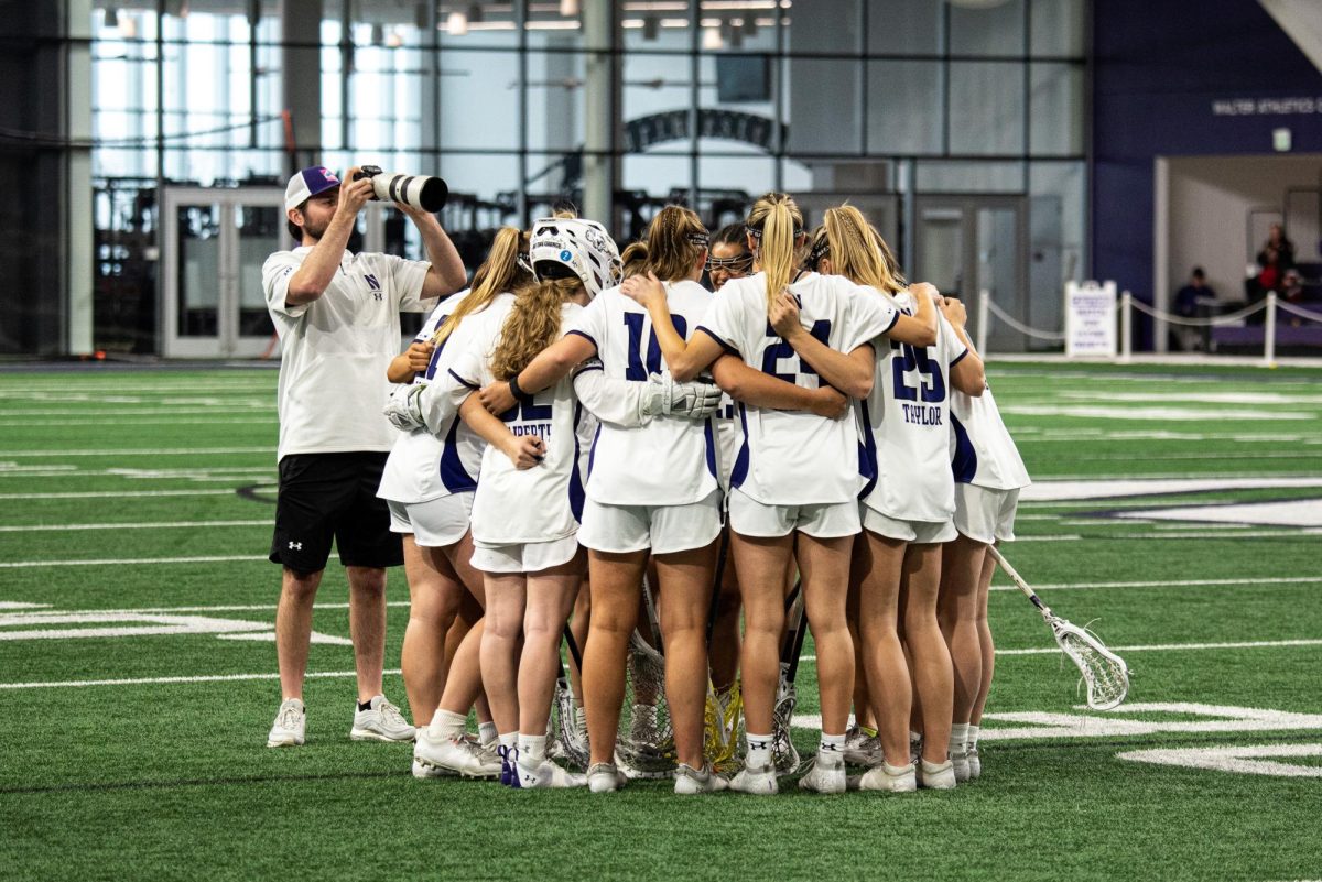 Northwestern huddles ahead of its game against Rutgers last Saturday. 