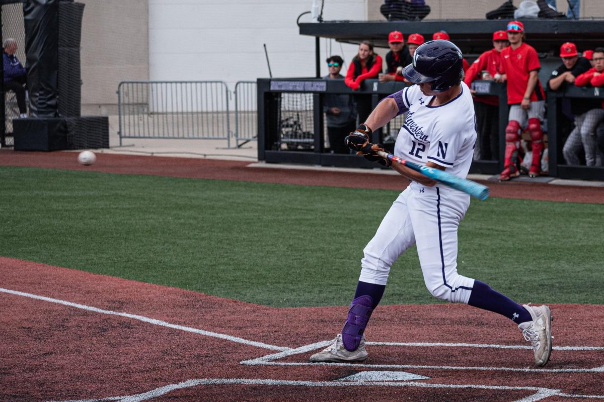 Freshman outfielder Jackson Freeman swings at a pitch during a game earlier this season. Freeman had five RBIs on the weekend, homering twice.