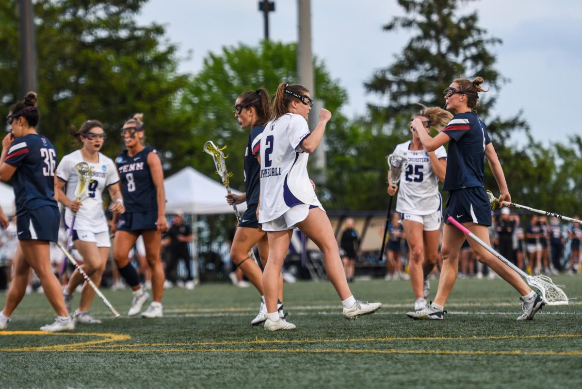Graduate student attacker Erin Coykendall celebrates after a goal against Penn Thursday night. Coykendall scored 11 points in the quarterfinal victory over the Quakers.