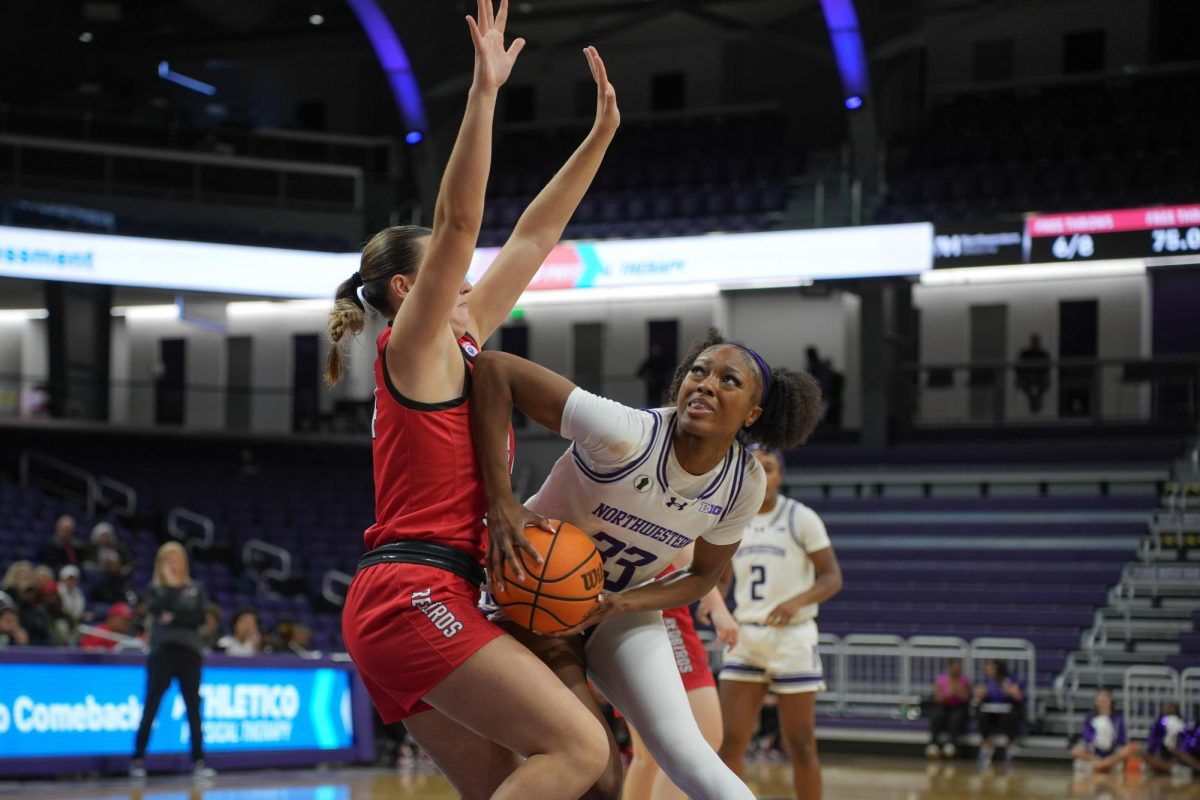 Graduate student forward Taylor Williams posts up a defender in a game earlier this year. 