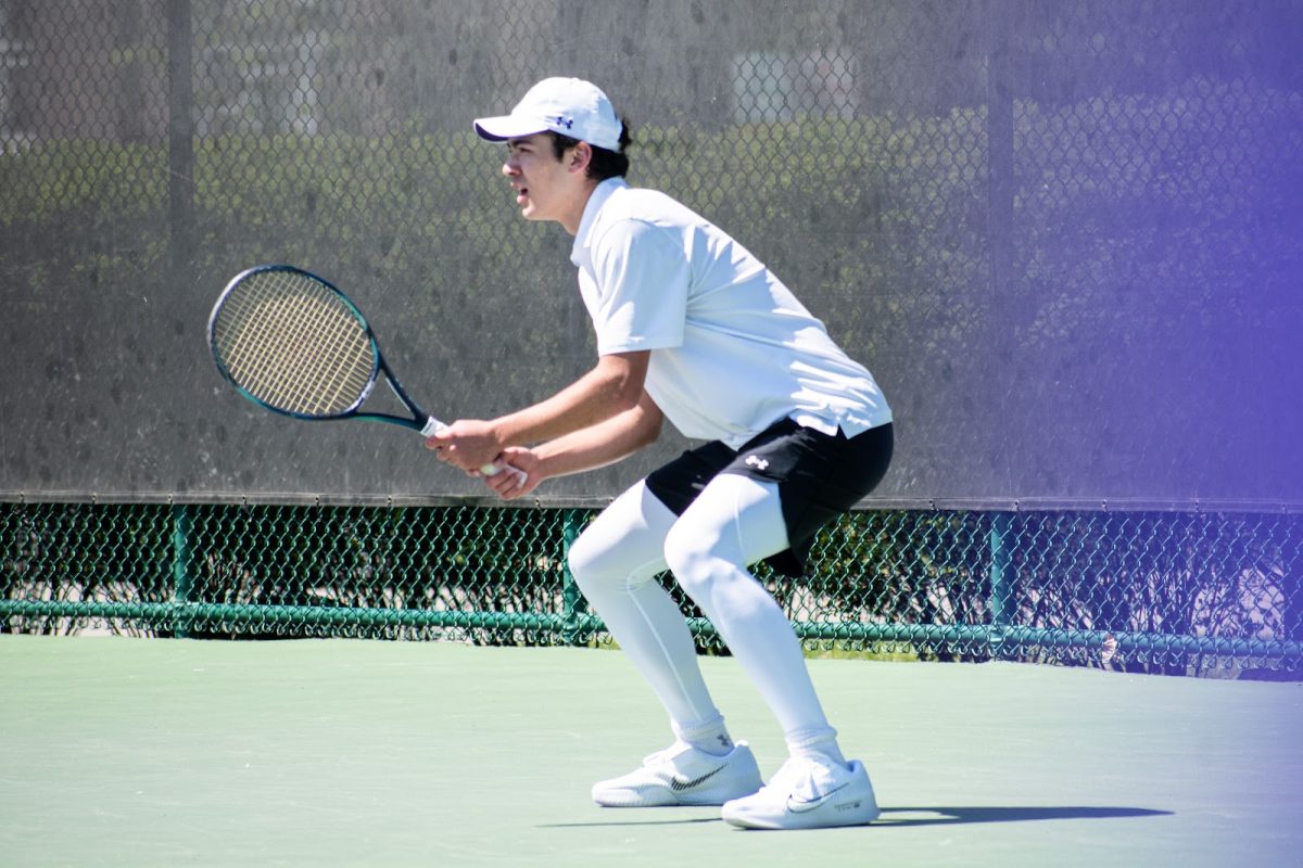 Sophomore Greyson Casey prepares to return a serve during a match last season.
