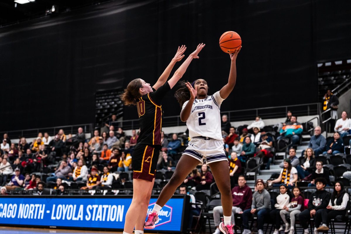 Graduate student guard Kyla Jones drives towards the basket in a game earlier this season. Jones collected 17 points in Northwestern’s loss to Minnesota Sunday. 