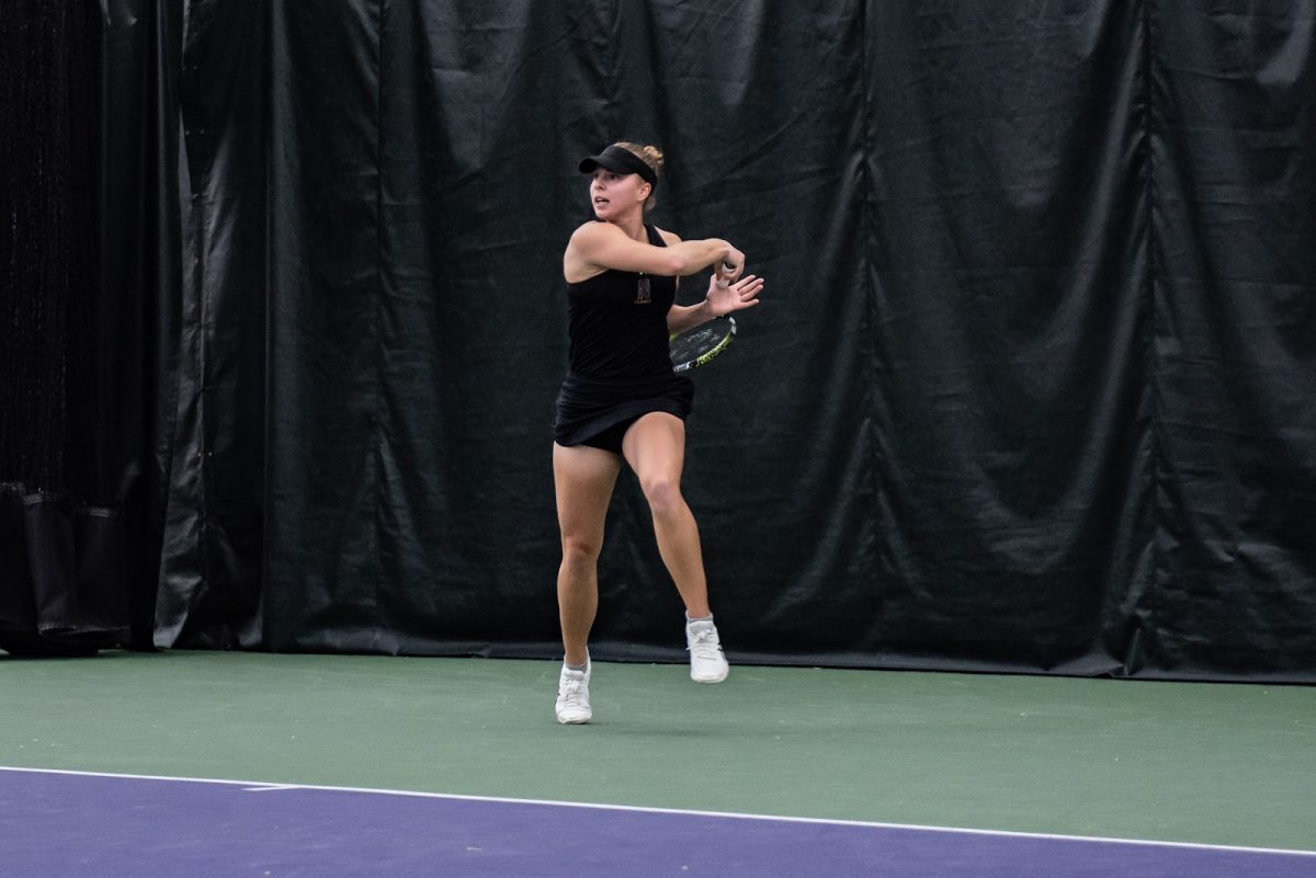 Senior Sydney Pratt hits a forehand in a match last season.