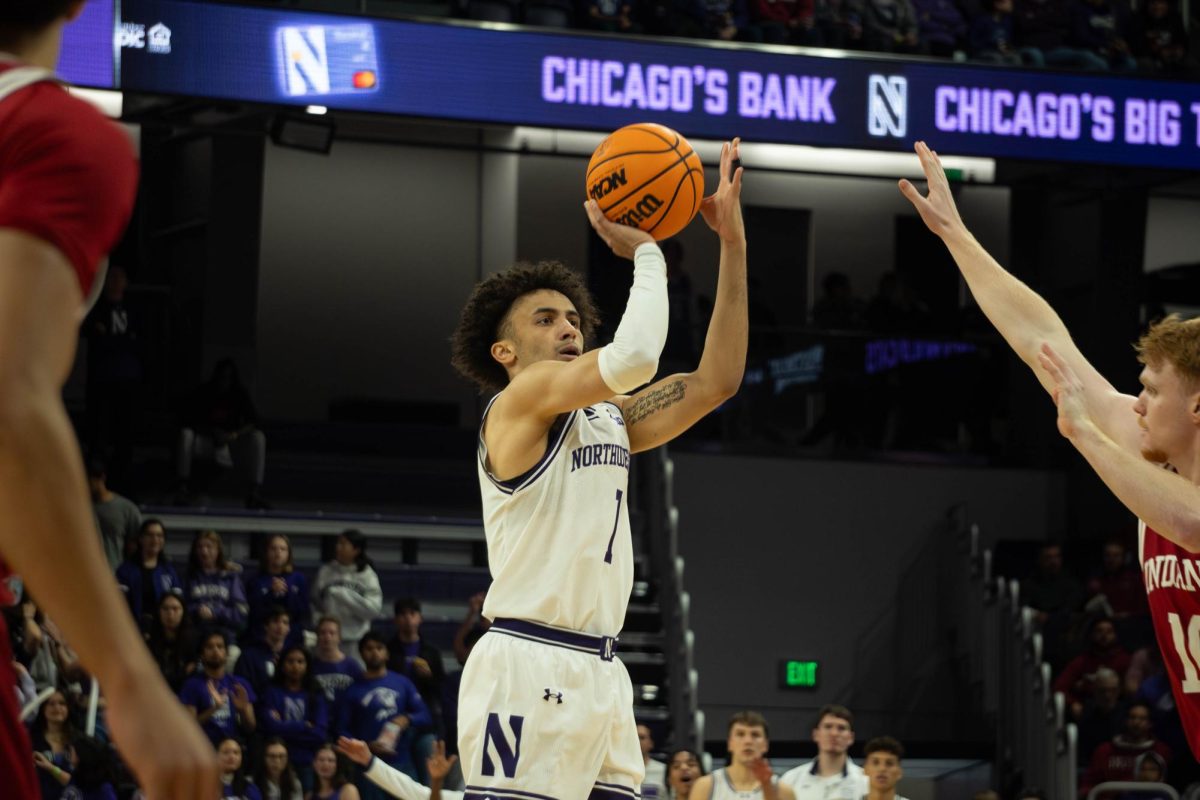 Graduate student guard Jalen Leach shoots a 3-pointer during Northwestern's Wednesday win over Indiana.