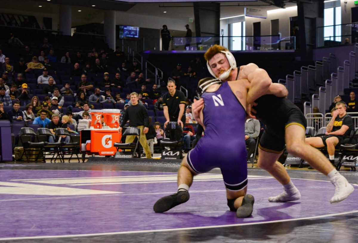 Redshirt senior Maxx Mayfield attempts a takedown against his opponent in a match last year.