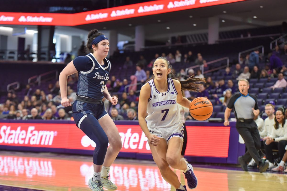 Junior guard Caroline Lau takes the ball toward the basket in Northwestern’s win over Penn State Sunday. Lau leads the Big Ten with 5.9 assists per game.
