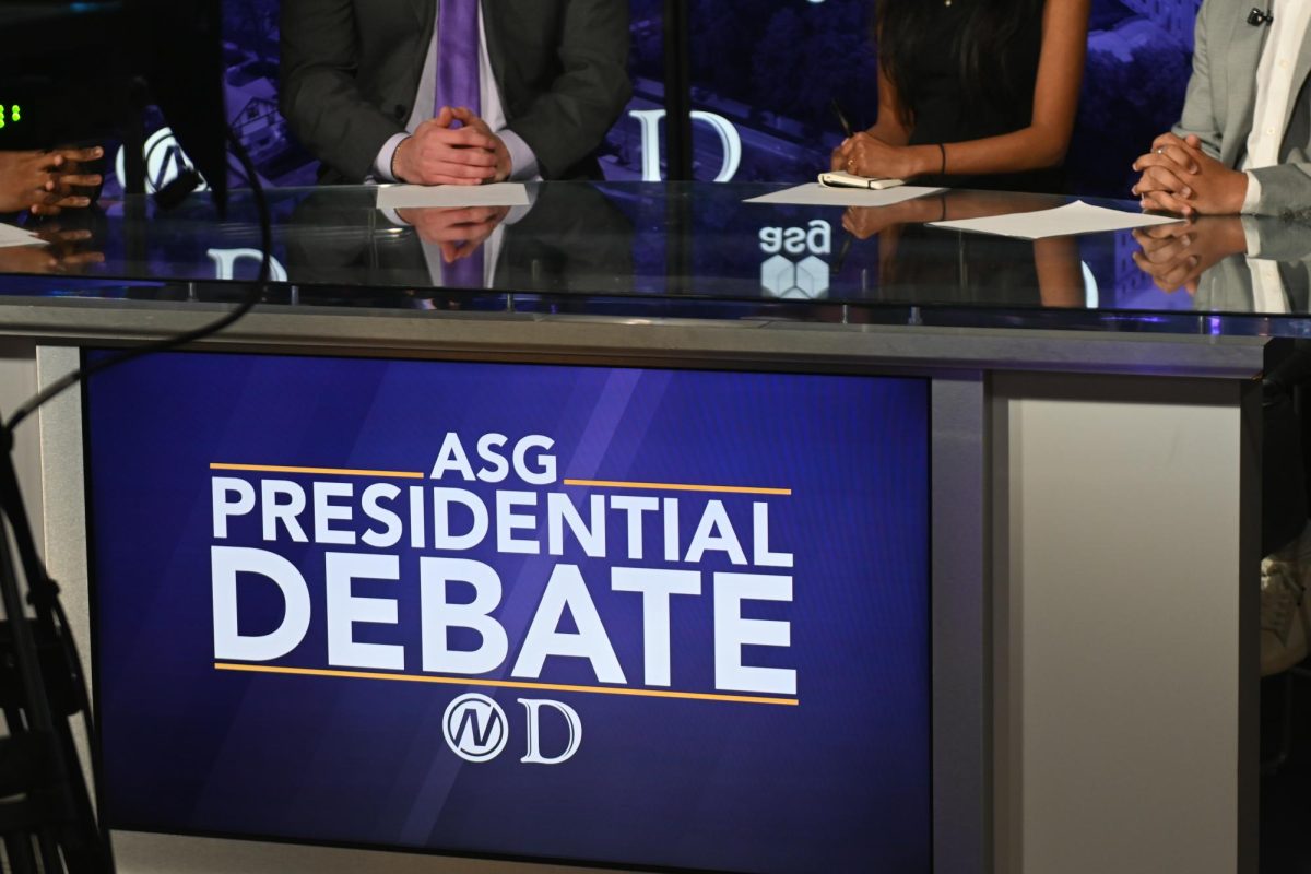 The four candidates prepare to debate at the Aida and Mike Feldman Broadcast and Digital Media Suite on MFC’s fourth floor.