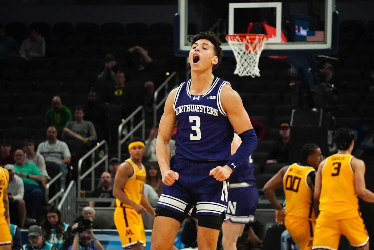 Graduate student guard Ty Berry celebrates after a 3-pointer in Northwestern's Big Ten Tournament-opening win over Minnesota Wednesday.