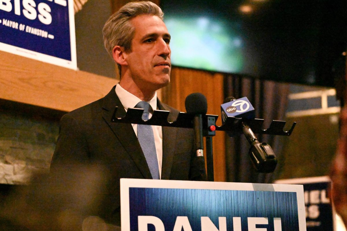 Man stands in front of a podium