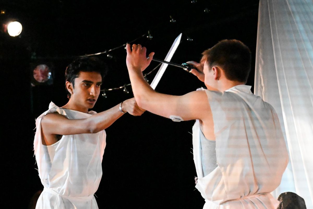Young Achilles (Communication freshman Arjun Shah) and Young Patroclus (Communication junior Ryan Lien) act out a sword fight in “Achilles and Patroclus.”