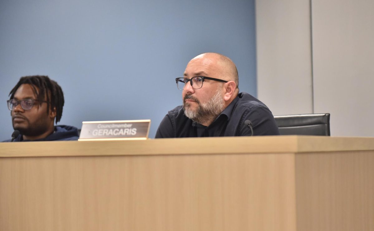 Ald. Juan Geracaris (9th) is seated at the City Council dais.