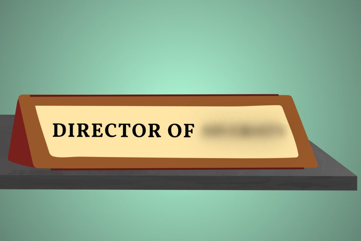 Name plate that reads “Director of” and the final word is blurred out.