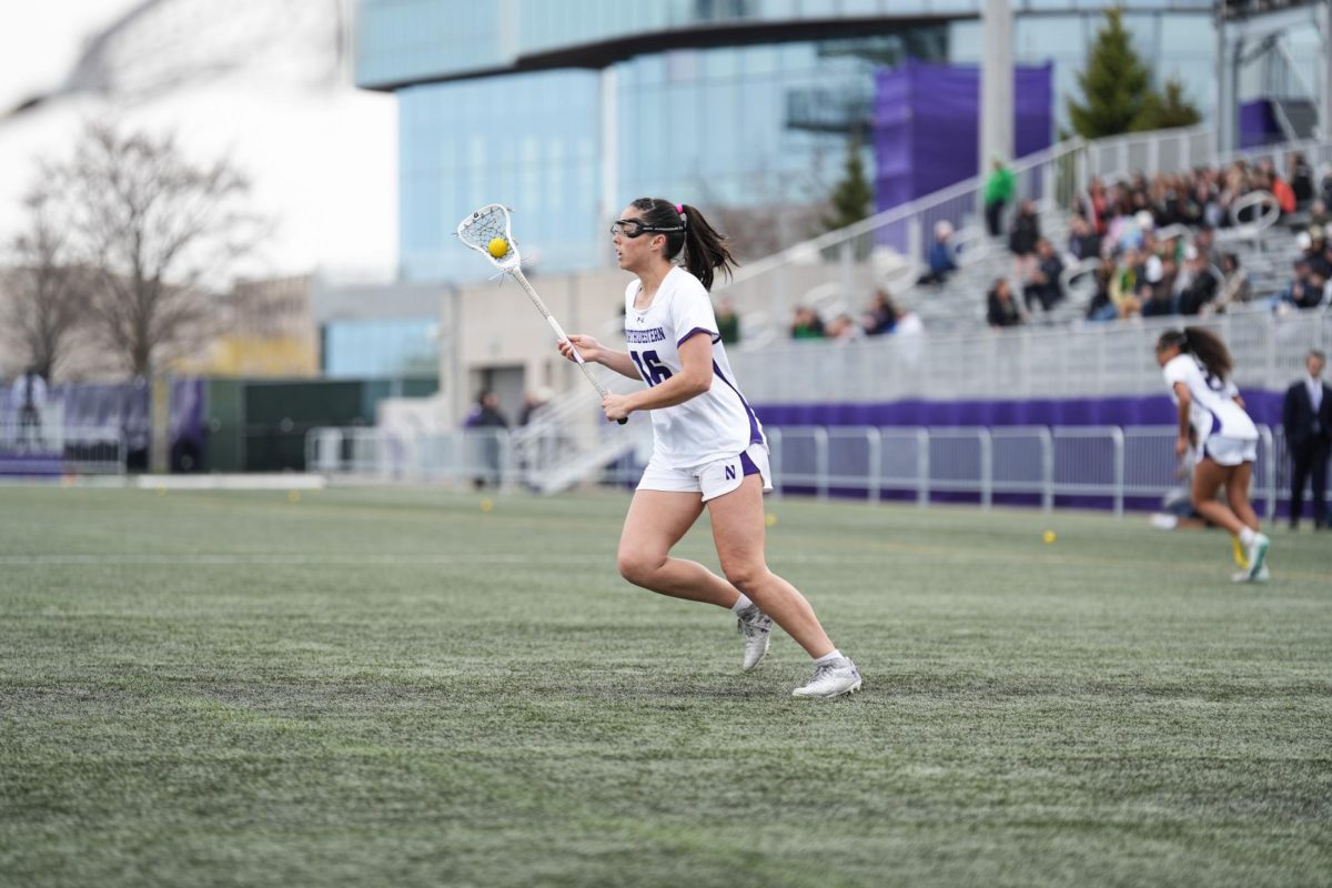 Graduate student attacker Niki Miles looks for a pass against Oregon earlier this season. She led the team in scoring Friday, tallying five goals.