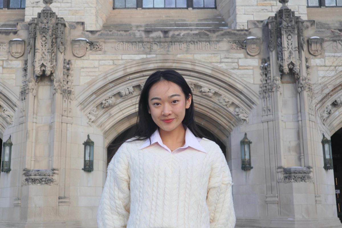 Katia Shek stands in front of Deering Library.