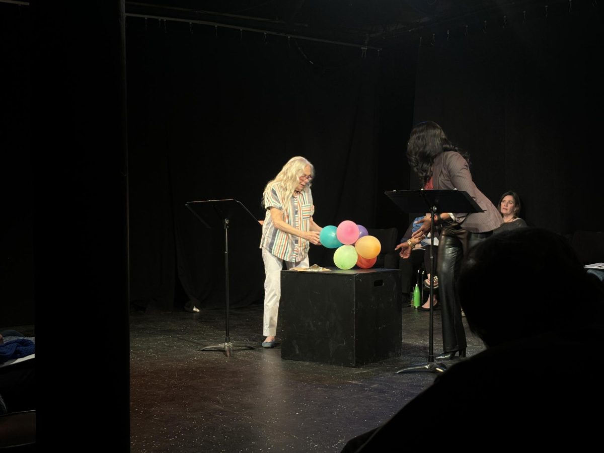 Two of the actors in “The Old Lady Project” perform “Just Upriver” by Charles Hertz on Monday.