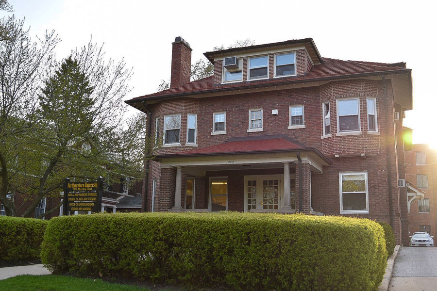 A brick building with a sign reading Judd A. and Marjorie Weinberg College of Arts and Sciences.