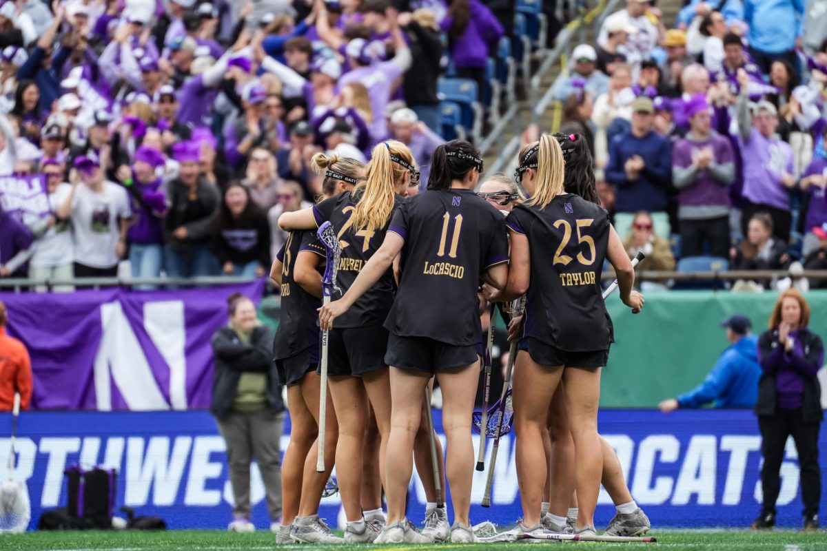 Northwestern huddles during its clash with North Carolina in the national championship.
